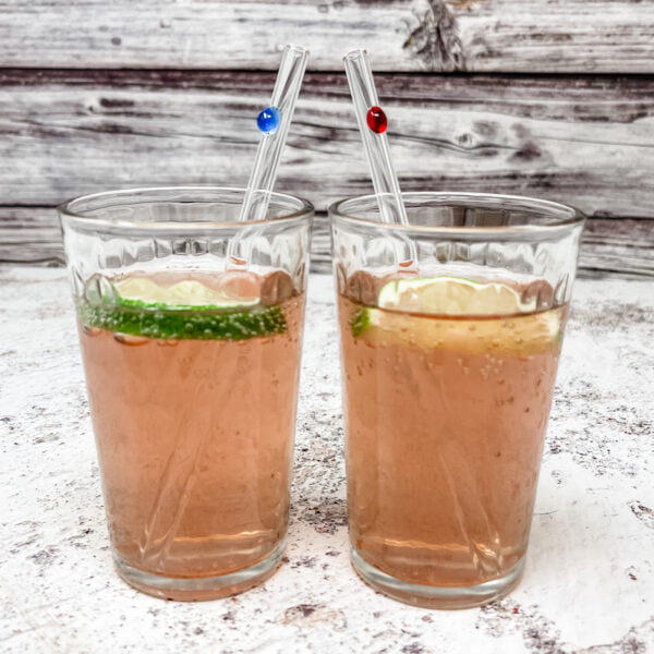 Couple designer skinny straws in drinks