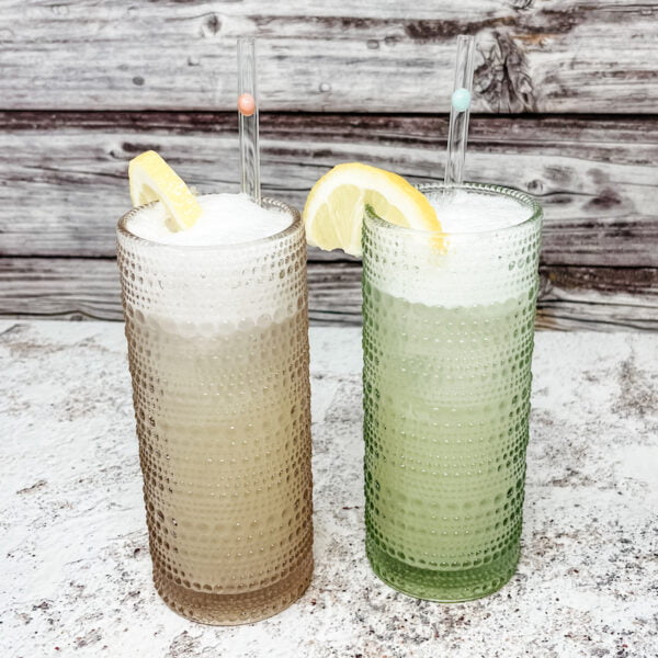 Couple designer skinny straws in drinks